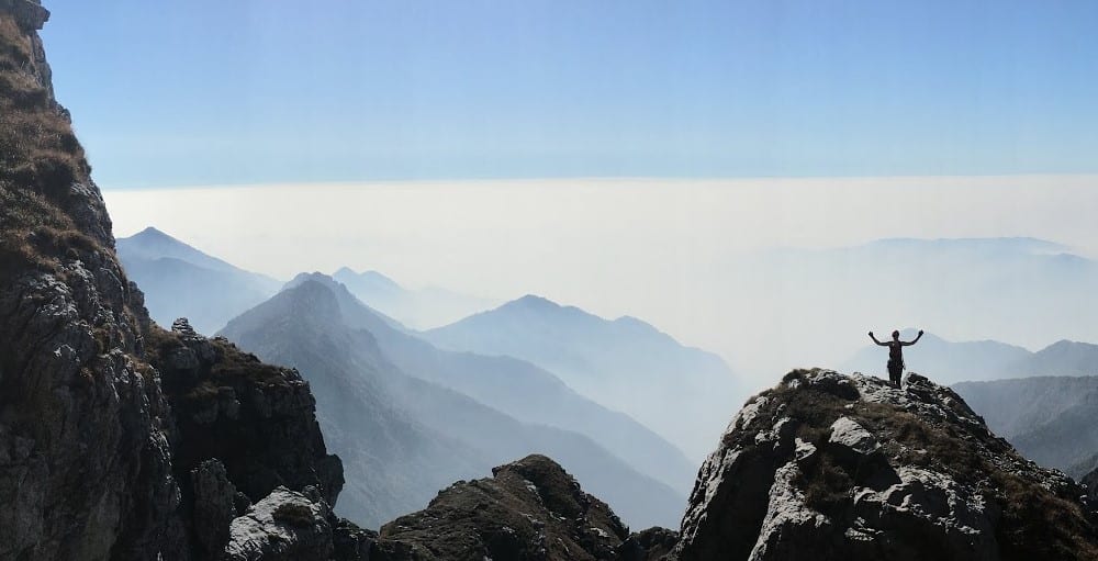 Mountaineer summiting a route on Monte Resegone, Lecco, Italy